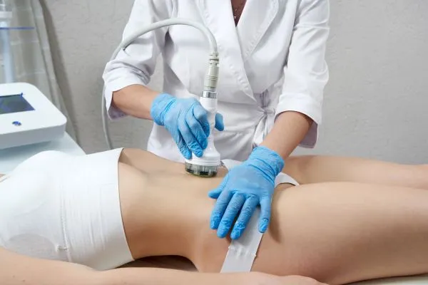 Lost the Weight but Not the Loose Skin? 2 woman having HIFU treatment on her stomach to combat loose skin High Wycombe following weight loss